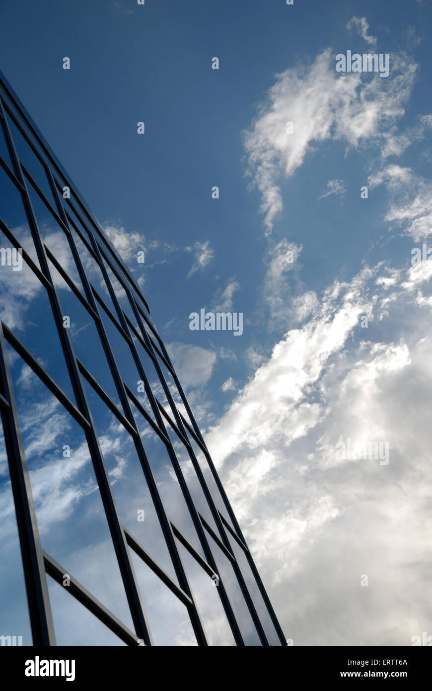 The facade of a modern building from blue glass reflects the sky Stock ...
