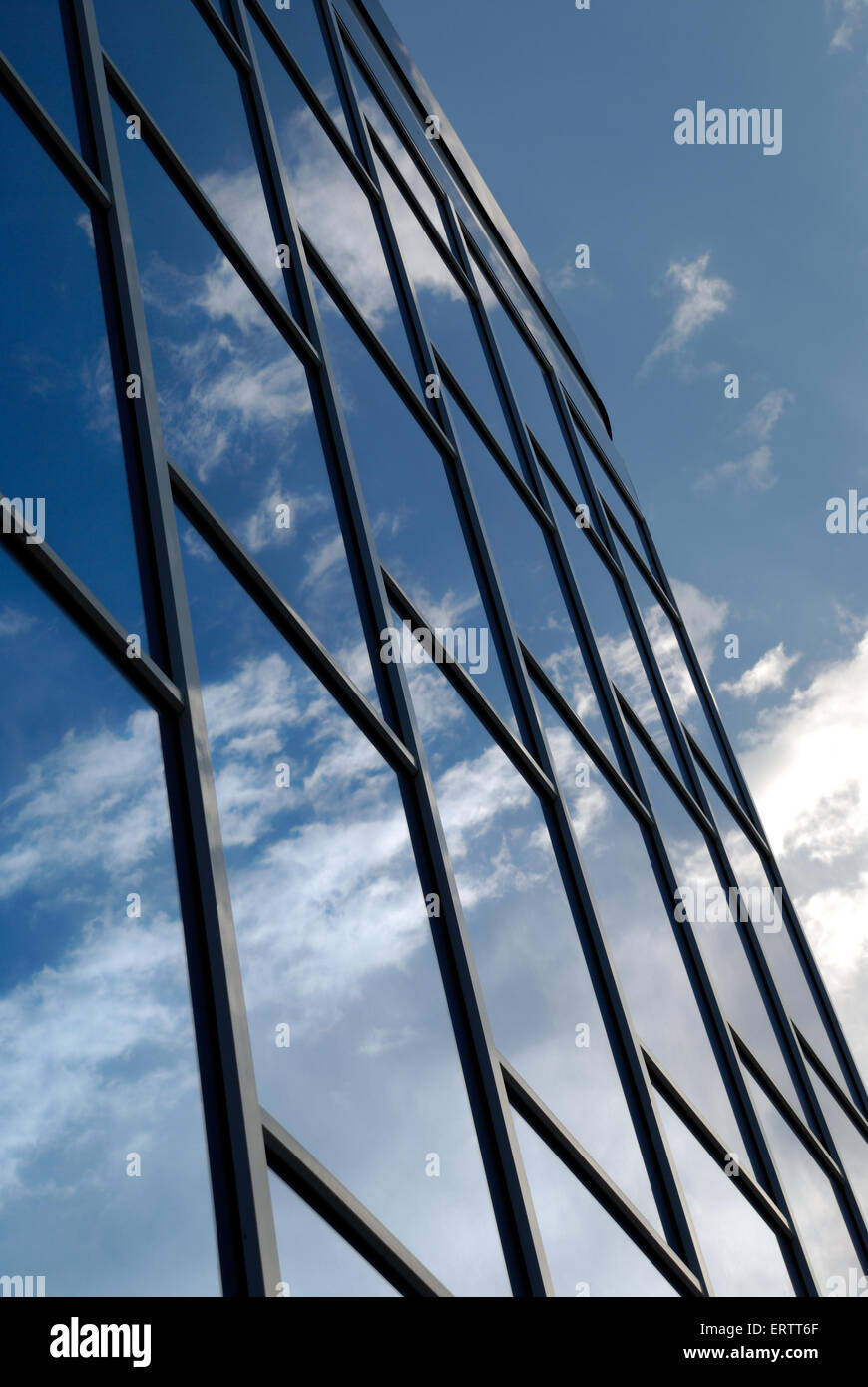 The facade of a modern building from blue glass reflects the sky Stock ...