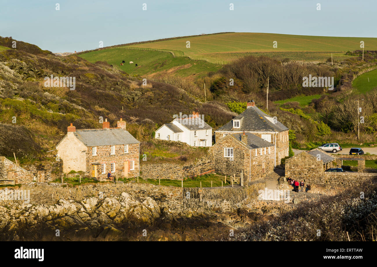 Houses on the harbourside at Port Quin village, Cornwall, England, UK Stock Photo