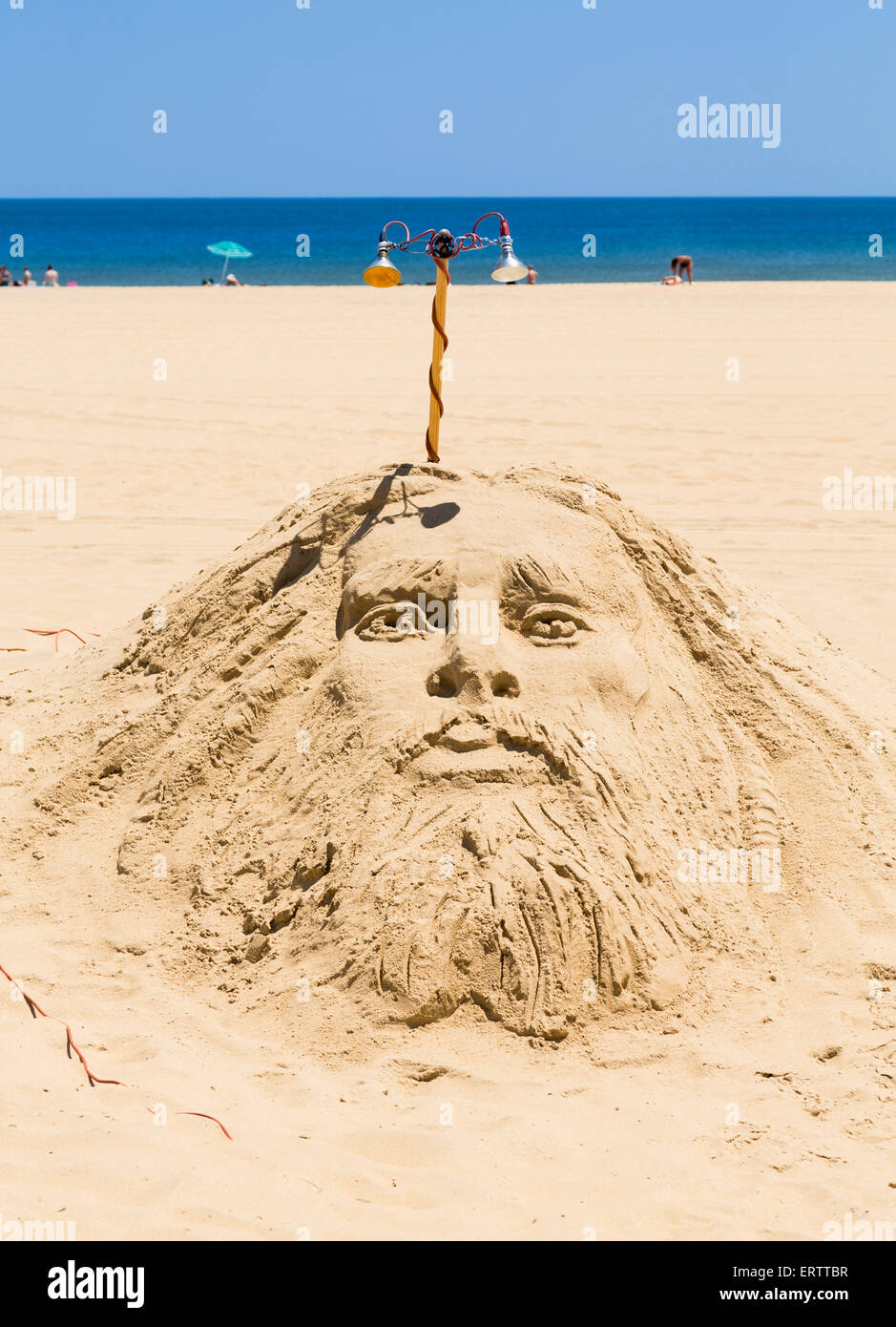 Religious sand sculpture of Jesus on beach, USA Stock Photo