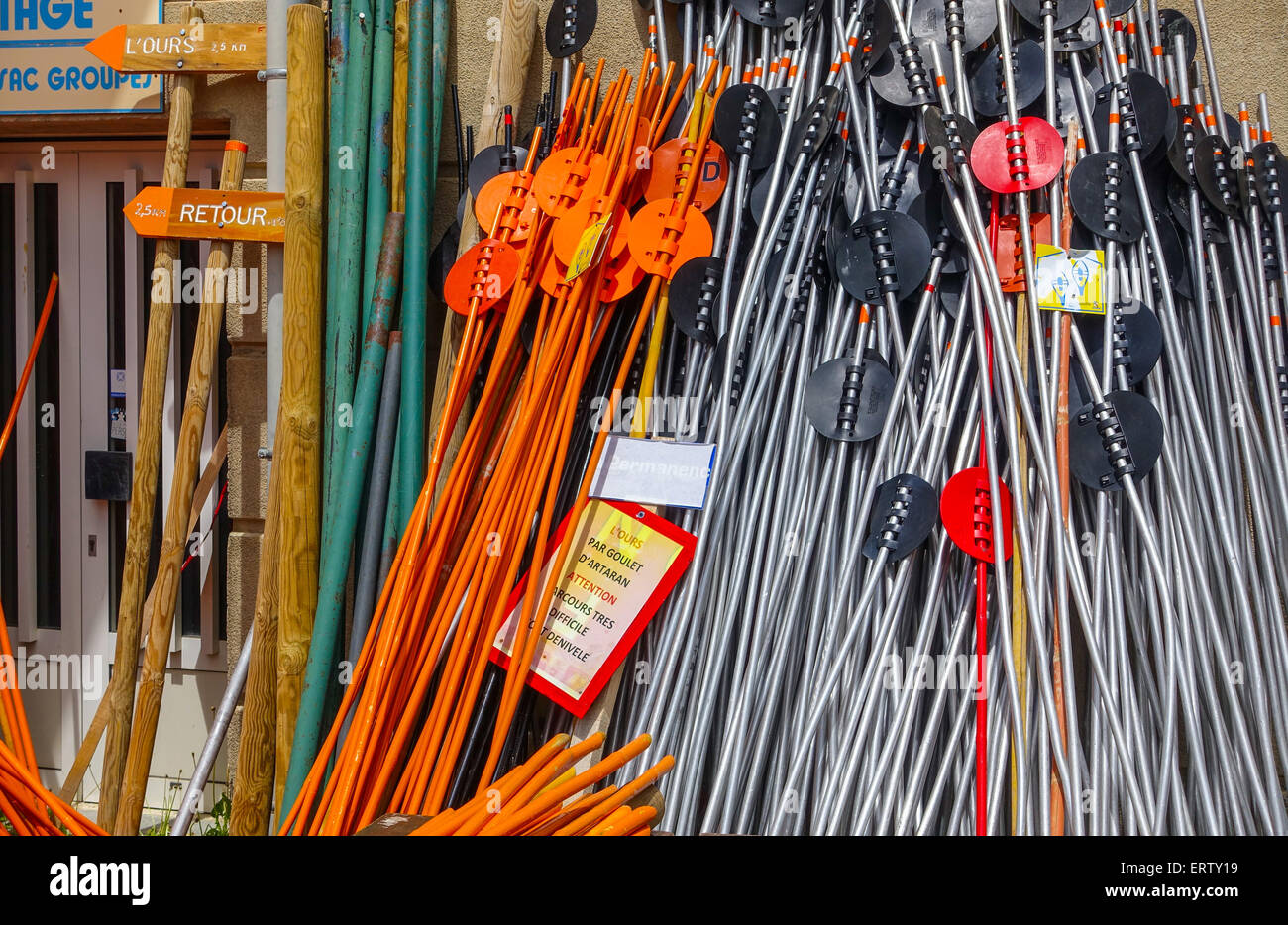 Brightly colored coloured skiing equipment in storage Stock Photo