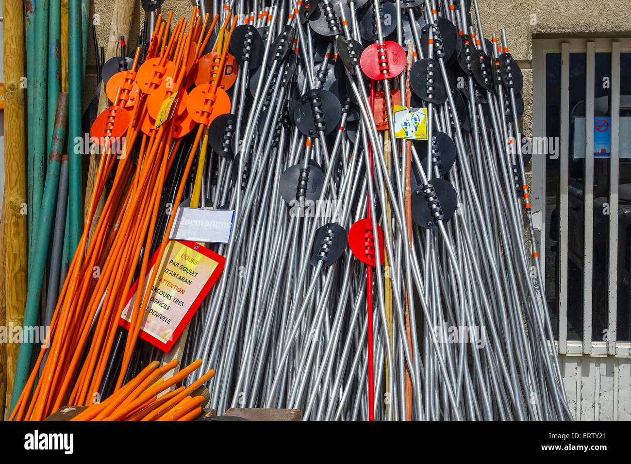 Brightly colored coloured skiing equipment in storage Stock Photo