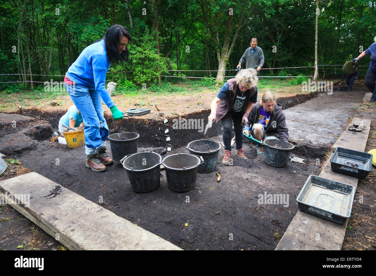 Archaeologists working on a Bronze Age excavation trench Stock Photo