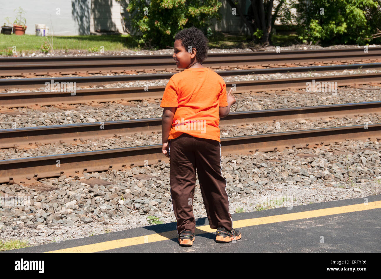 Boy waiting for train Stock Photo Alamy