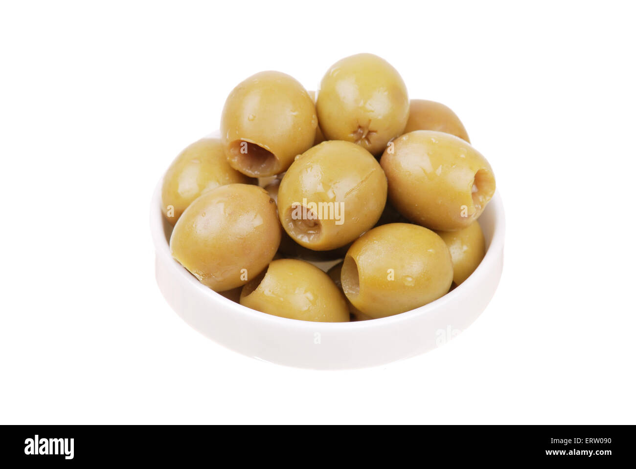 Green olives on a white plate isolated Stock Photo
