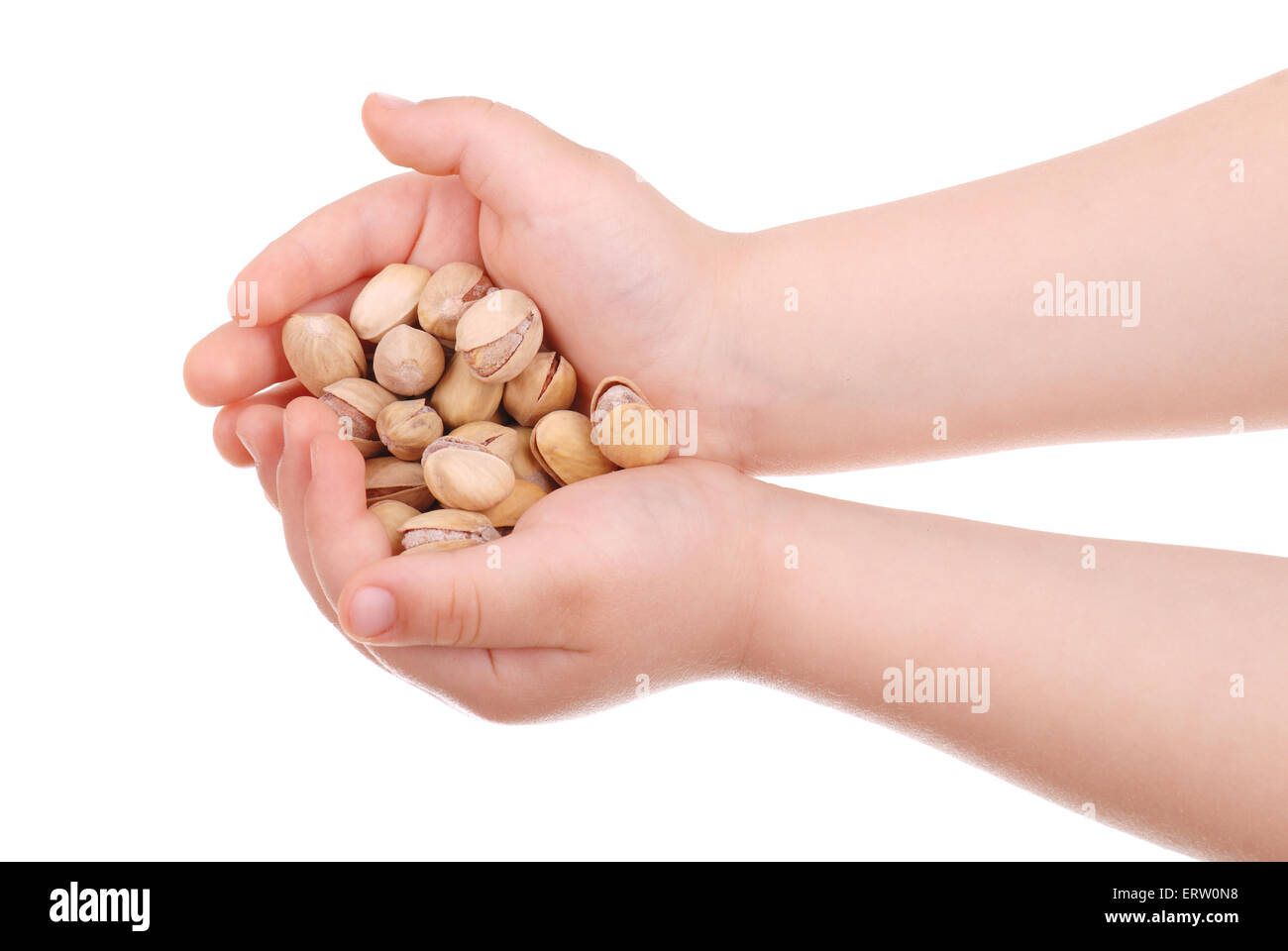 The children's hand holds nuts isolated Stock Photo Alamy