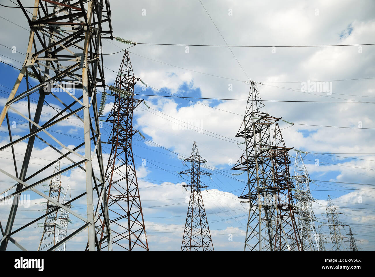 High voltage electric line on blue sky background Stock Photo - Alamy