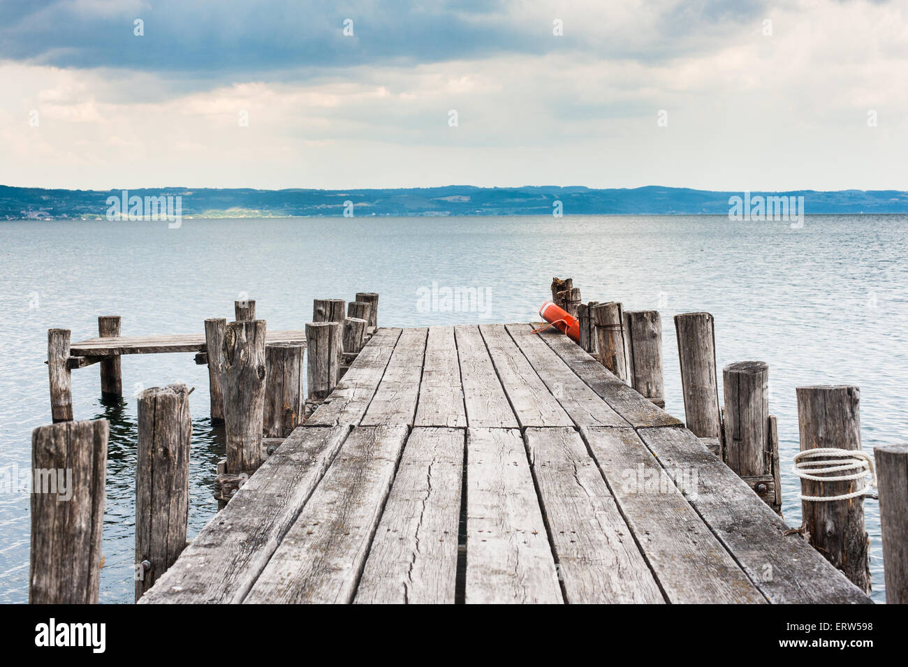 View from jetty on lake in cloudy autumn day Stock Photo