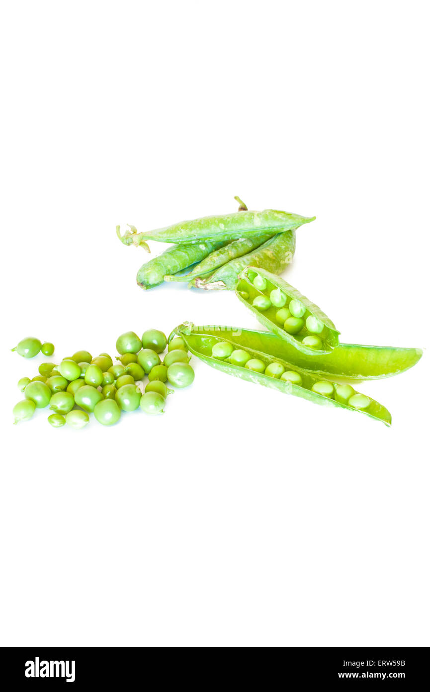 Fresh raw peas and pods on white background vertical frame Stock Photo