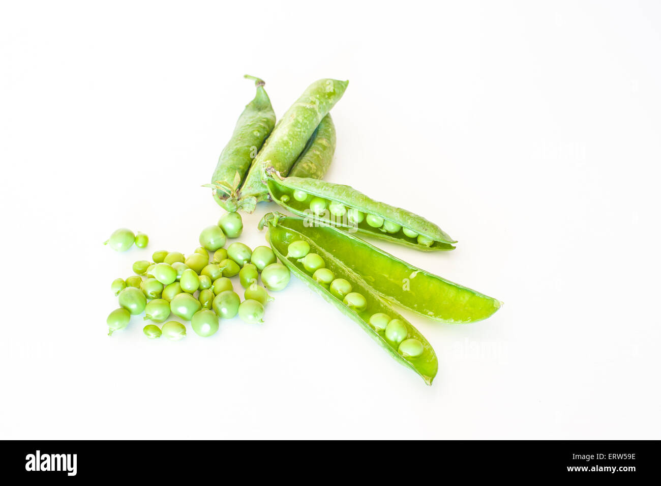 Fresh raw peas and pods on white background horizontal frame Stock Photo