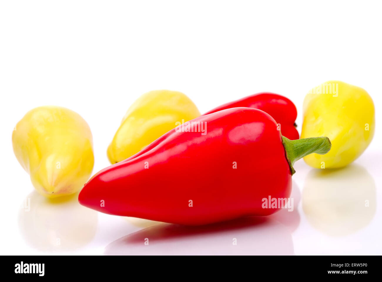 The red and yellow peppers on a white Stock Photo - Alamy
