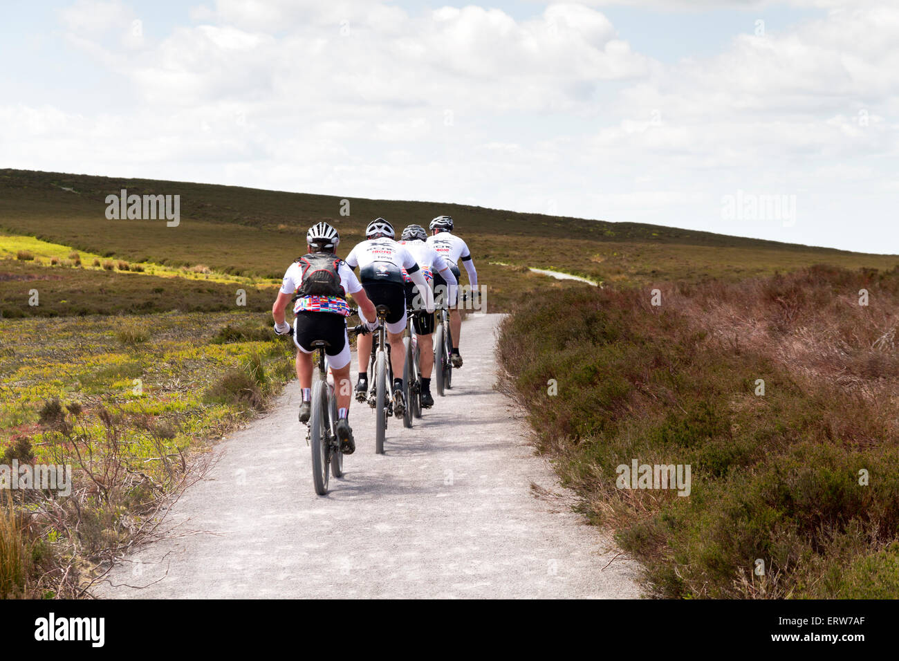 Four cyclists cycling along the Long Mynd in Shropshire Stock Photo