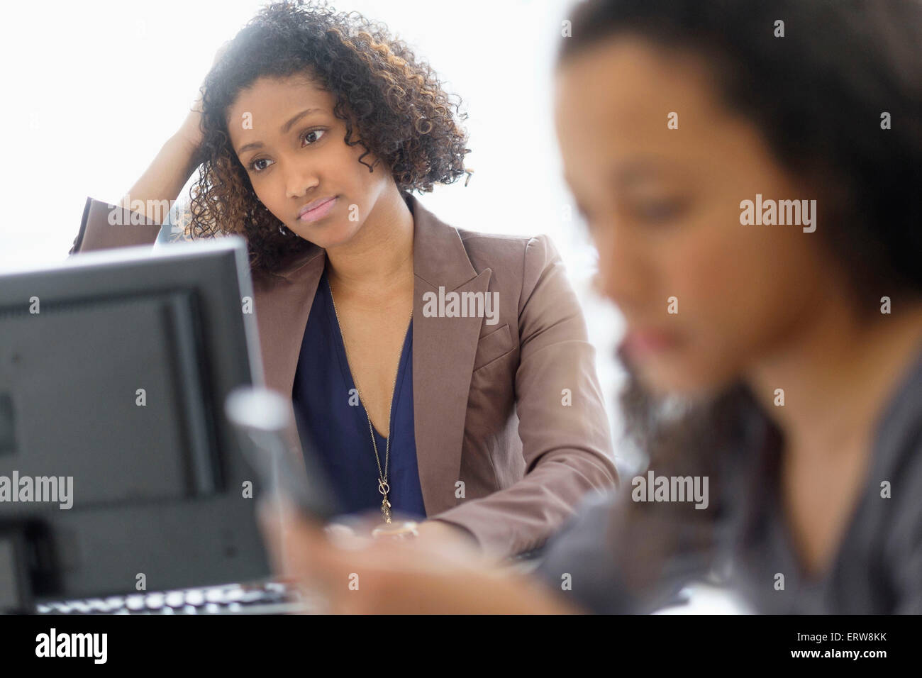 Businesswomen working in office Stock Photo