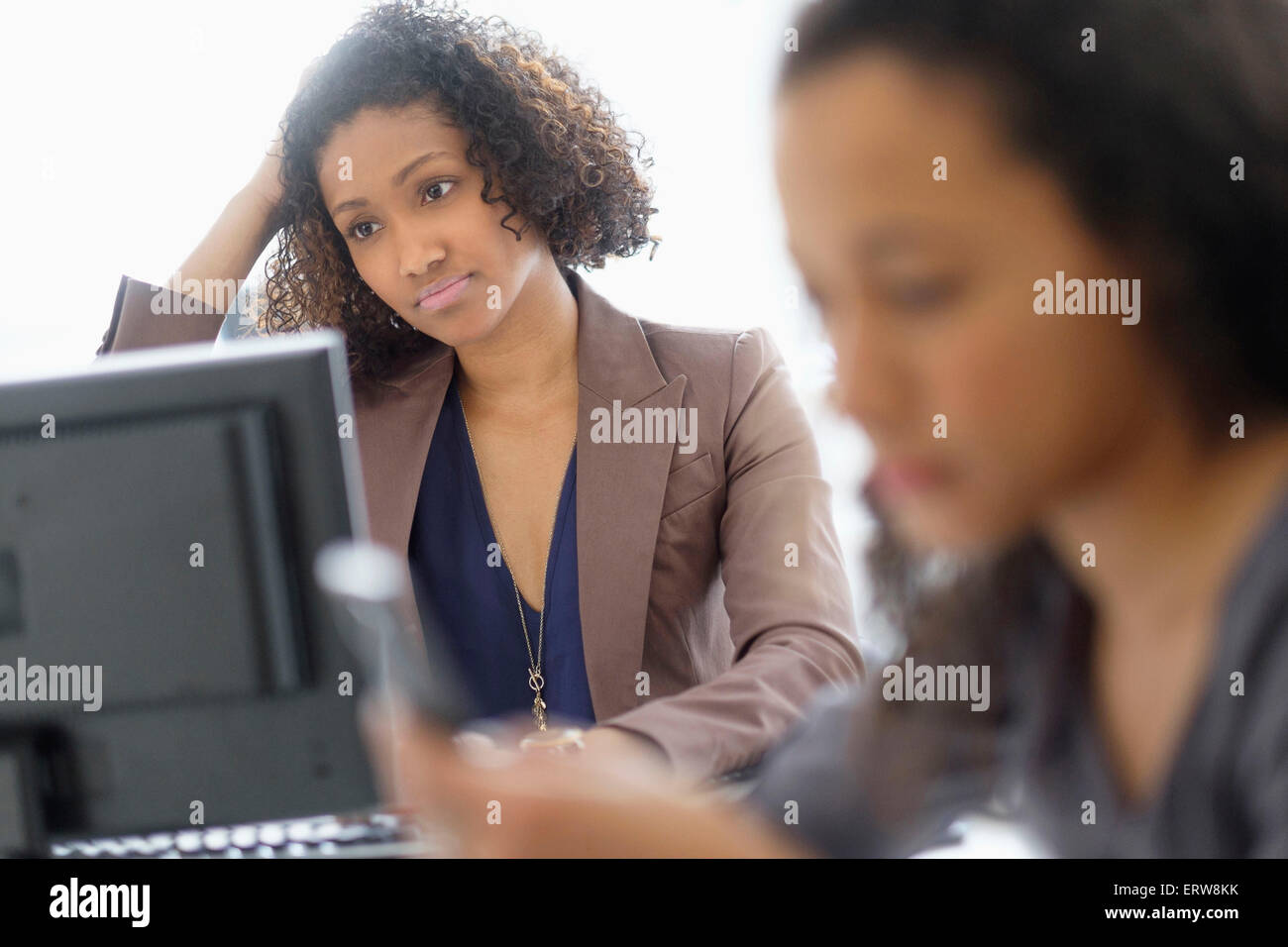 Businesswomen working in office Stock Photo - Alamy