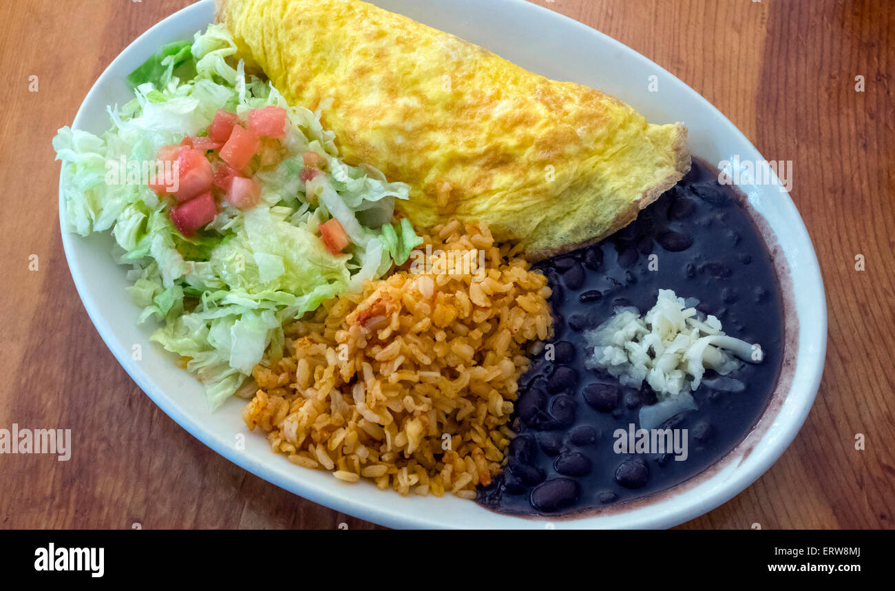 A Mexican brunch: omelet, black beans, brown rice and salad Stock Photo