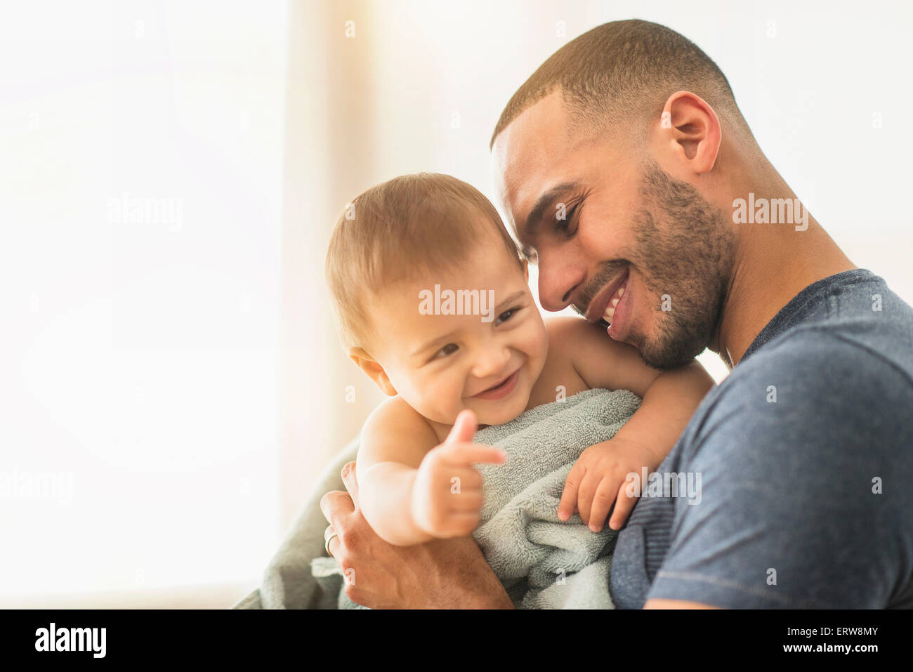 Father drying baby son with towel after bath Stock Photo Alamy