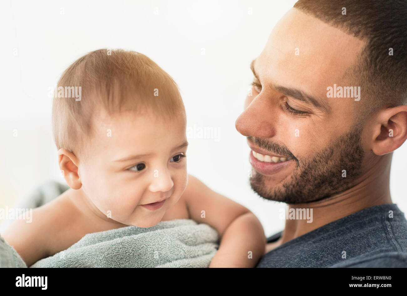 Father drying baby son with towel after bath Stock Photo Alamy