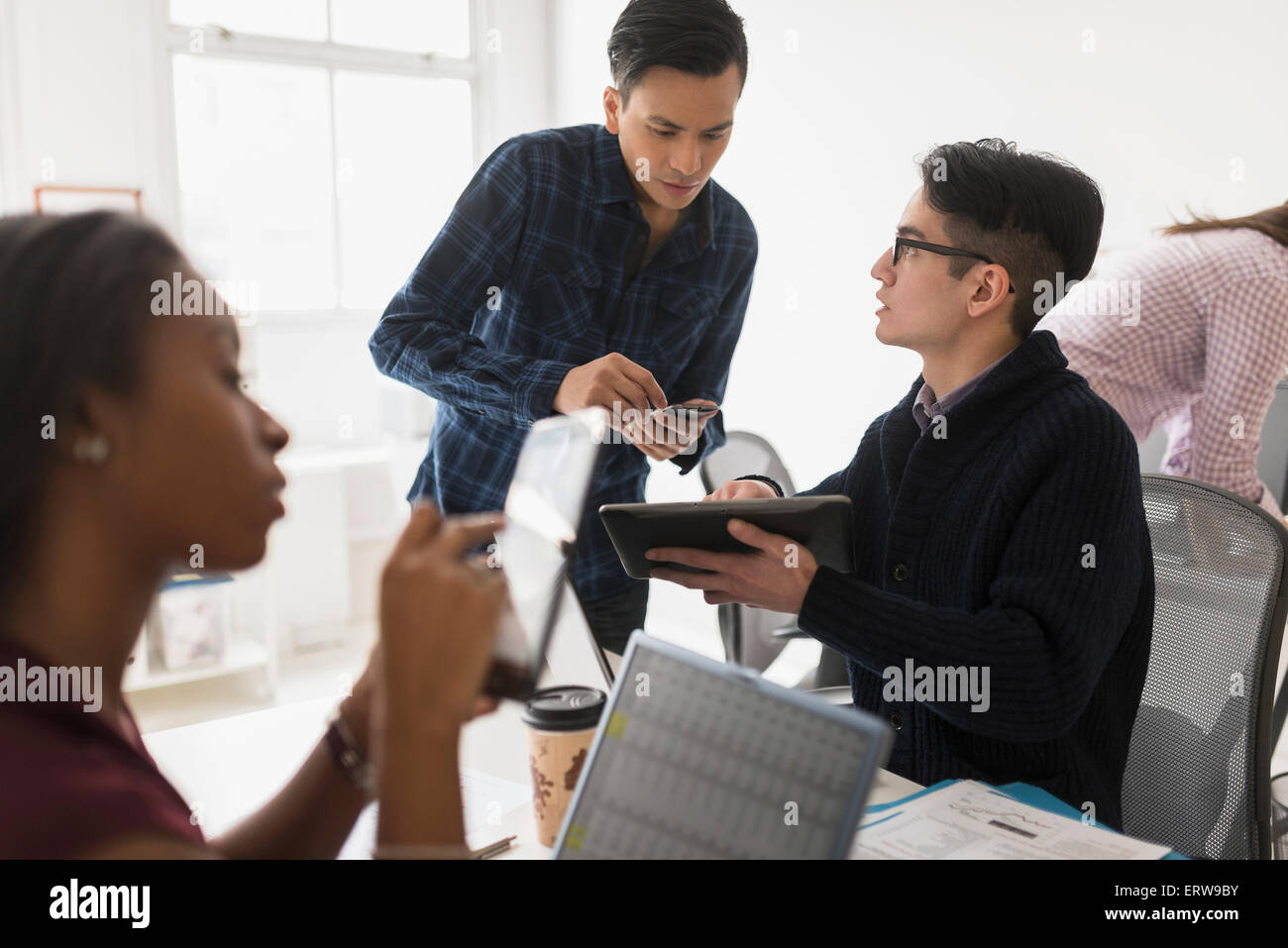 Business people using technology in office Stock Photo