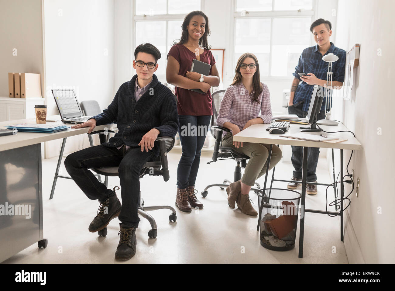 Business people smiling in office Stock Photo