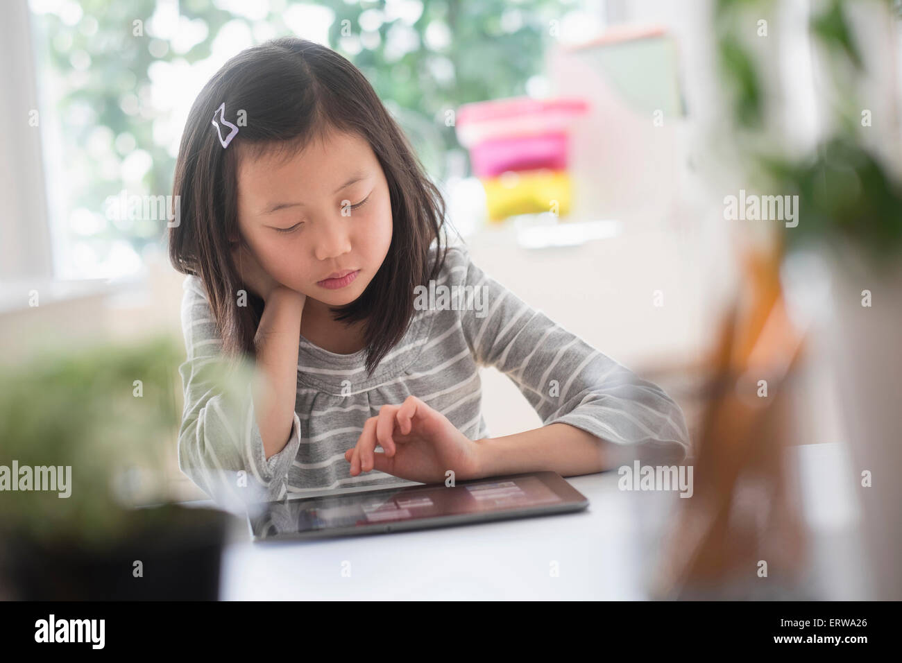 Chinese student using digital tablet Stock Photo