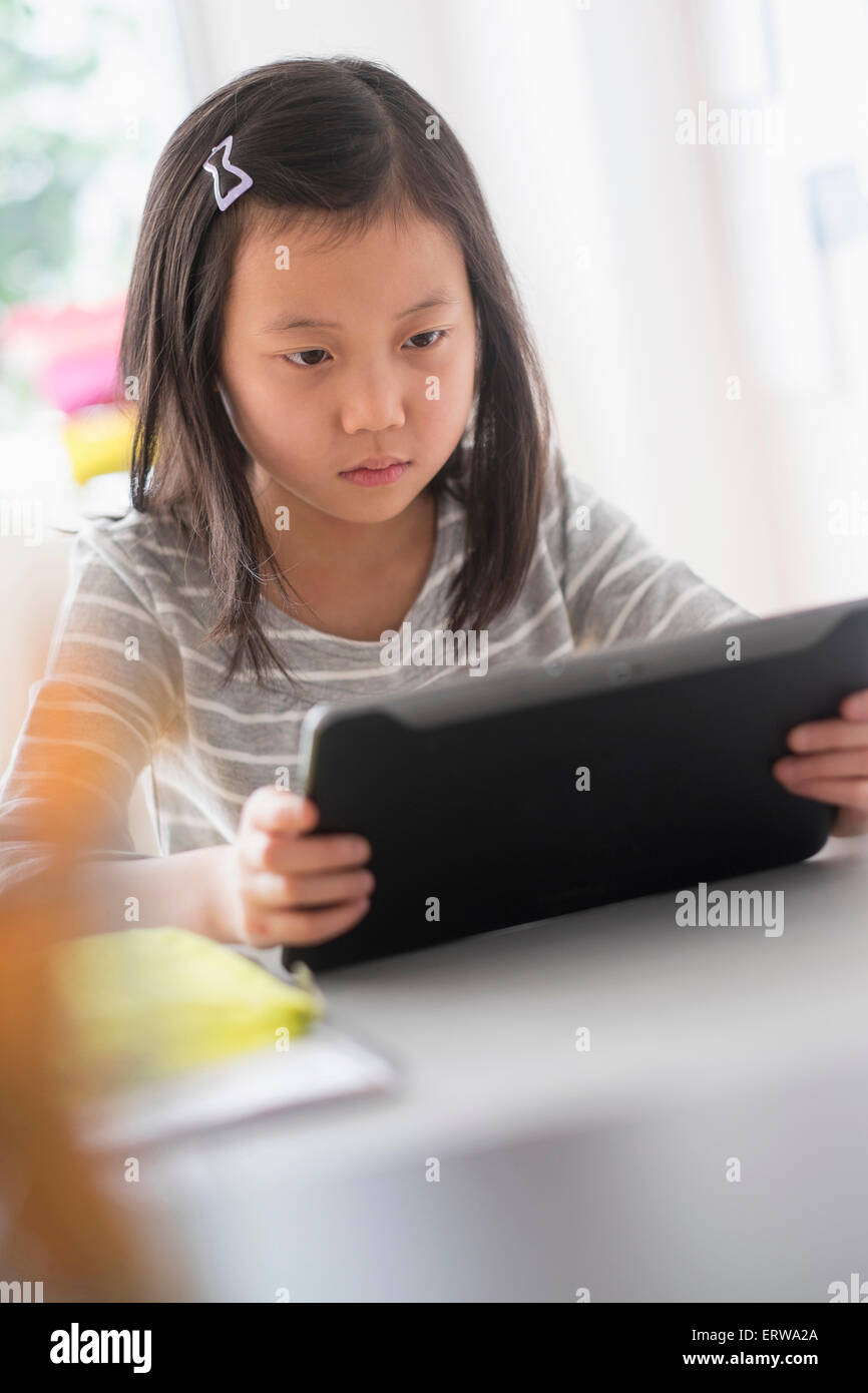 Chinese student using digital tablet Stock Photo