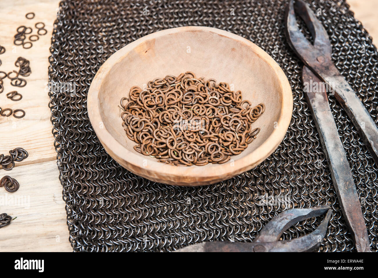 Making of a chain armor. View of details, tools, metal links and rings for making of a chain