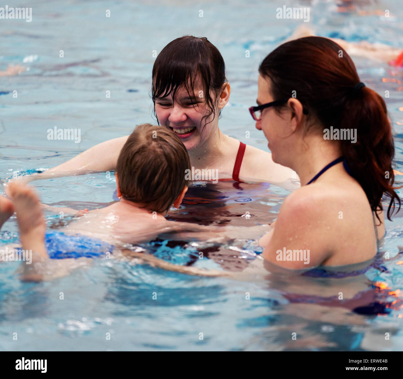 A young boy (two and a half years old) learning to swim Stock Photo