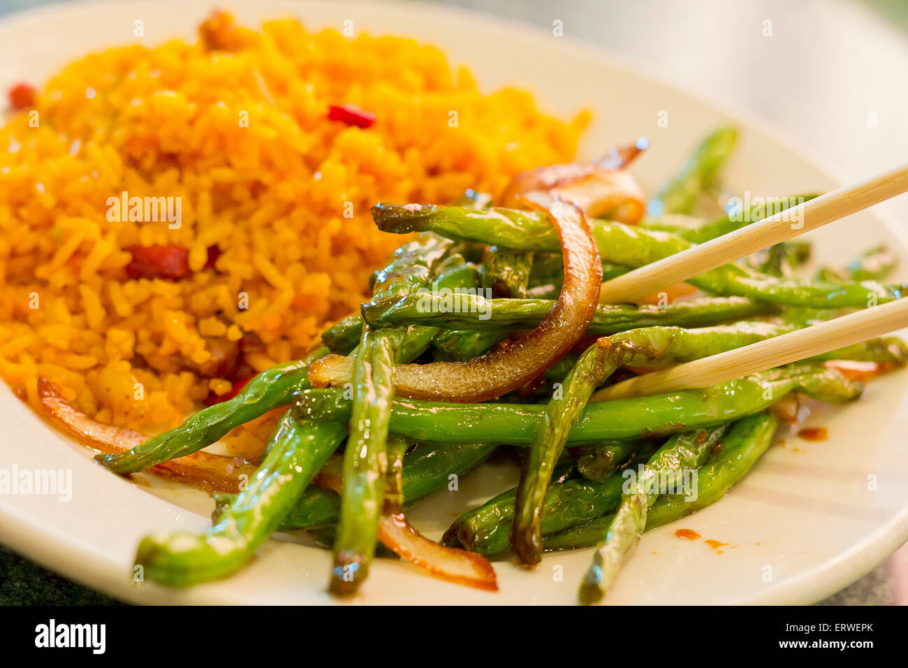 Chinese sauteed string beans in a brown oyster sauce with pork fried