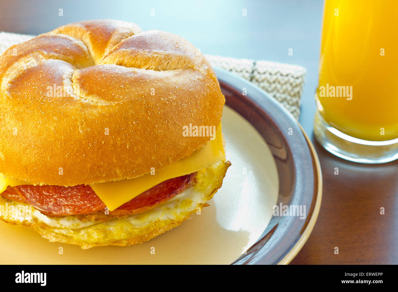 Taylor ham, pork roll, egg and cheese breakfast sandwich on a kaiser