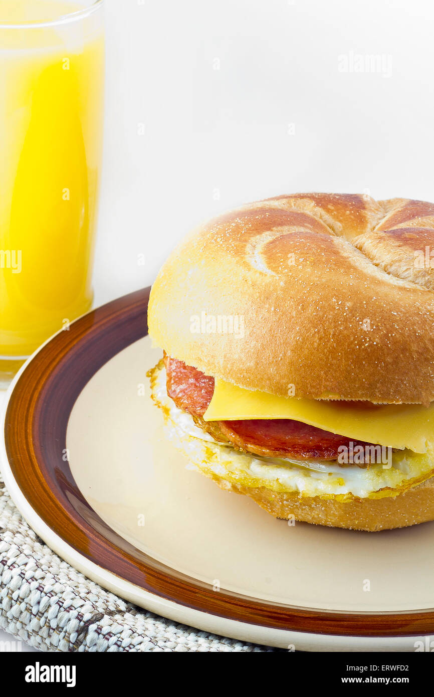 Taylor ham, pork roll, egg and cheese breakfast sandwich on a kaiser