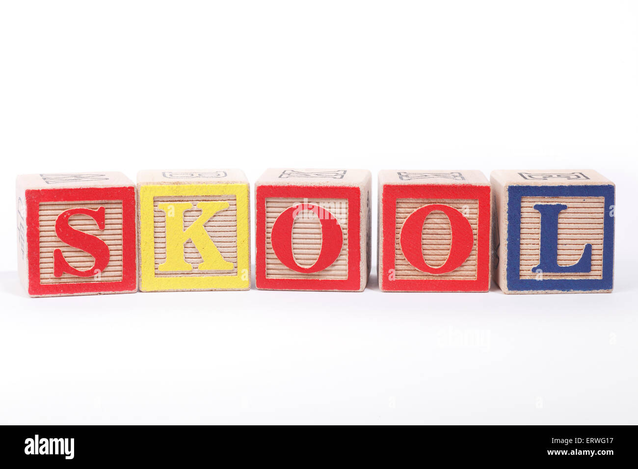The word 'SKOOL' spelt out with Children's building blocks Stock Photo