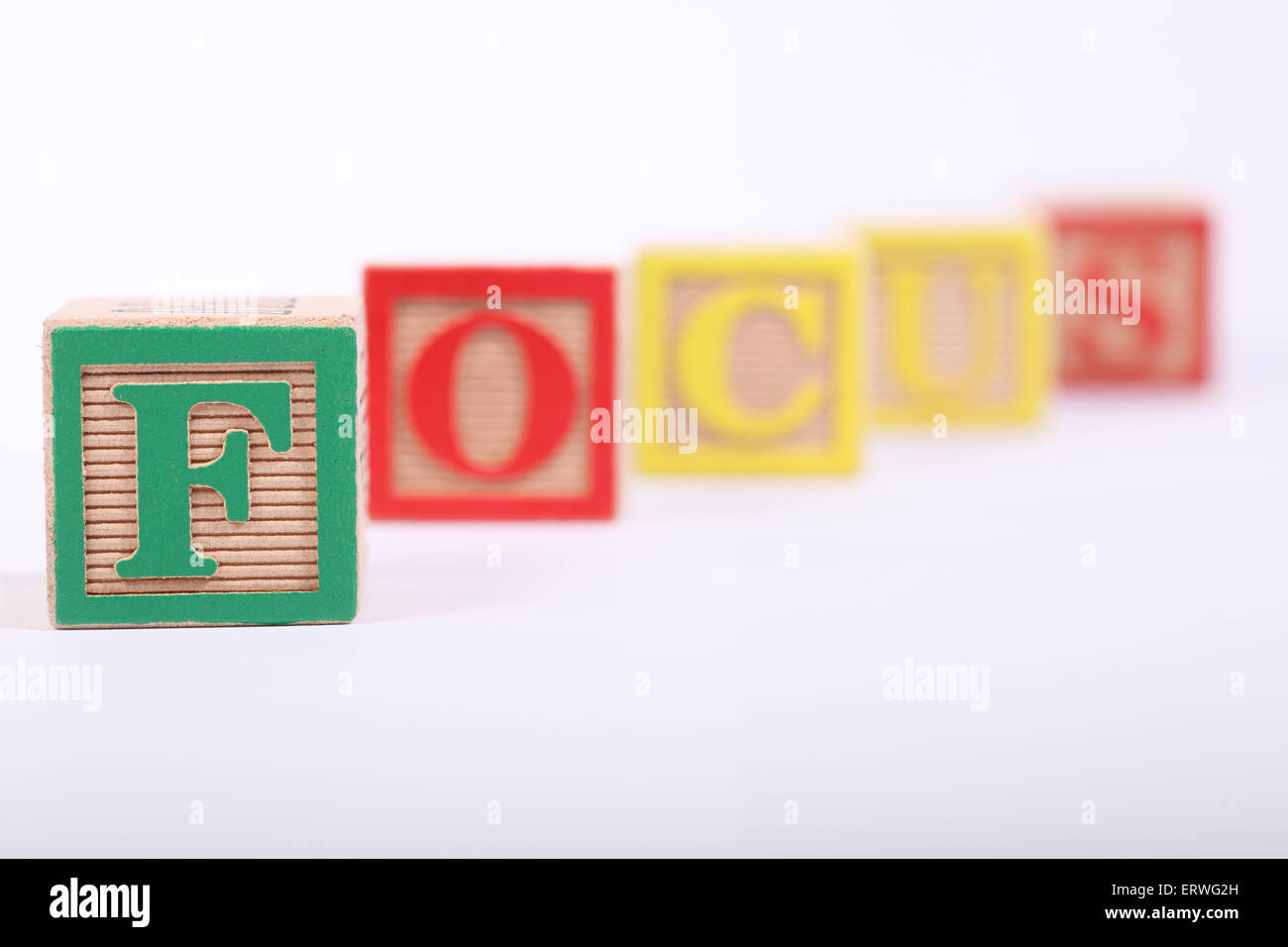 Children's Building Block showing a shallow depth of field with just the F in focus Stock Photo