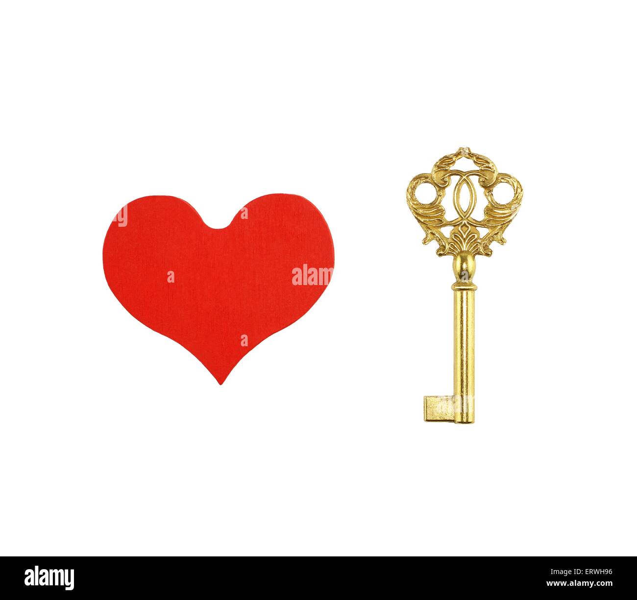 Red painted wooden heart and bronze key isolated on white background Stock Photo
