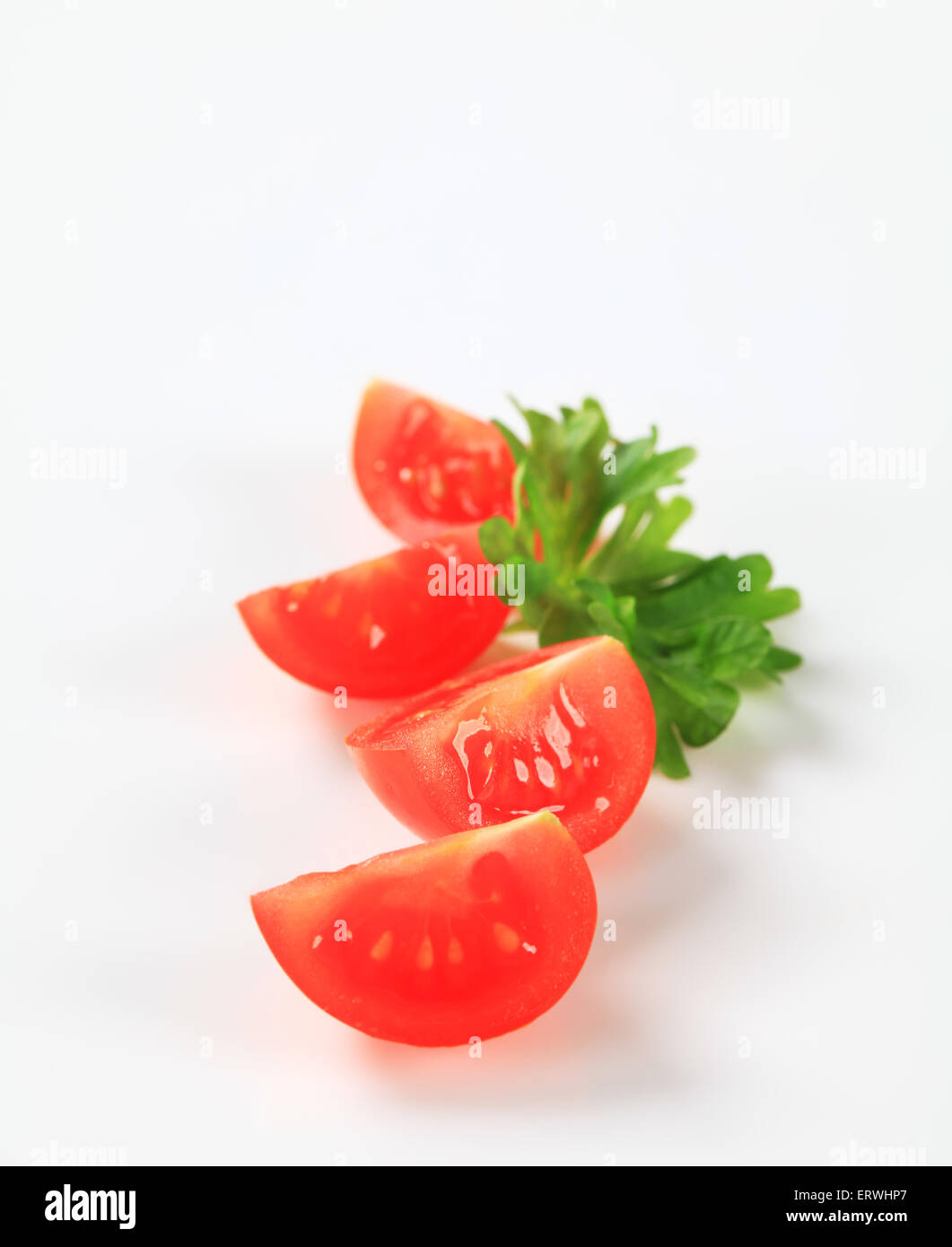 Studio shot of fresh tomato quarters Stock Photo - Alamy