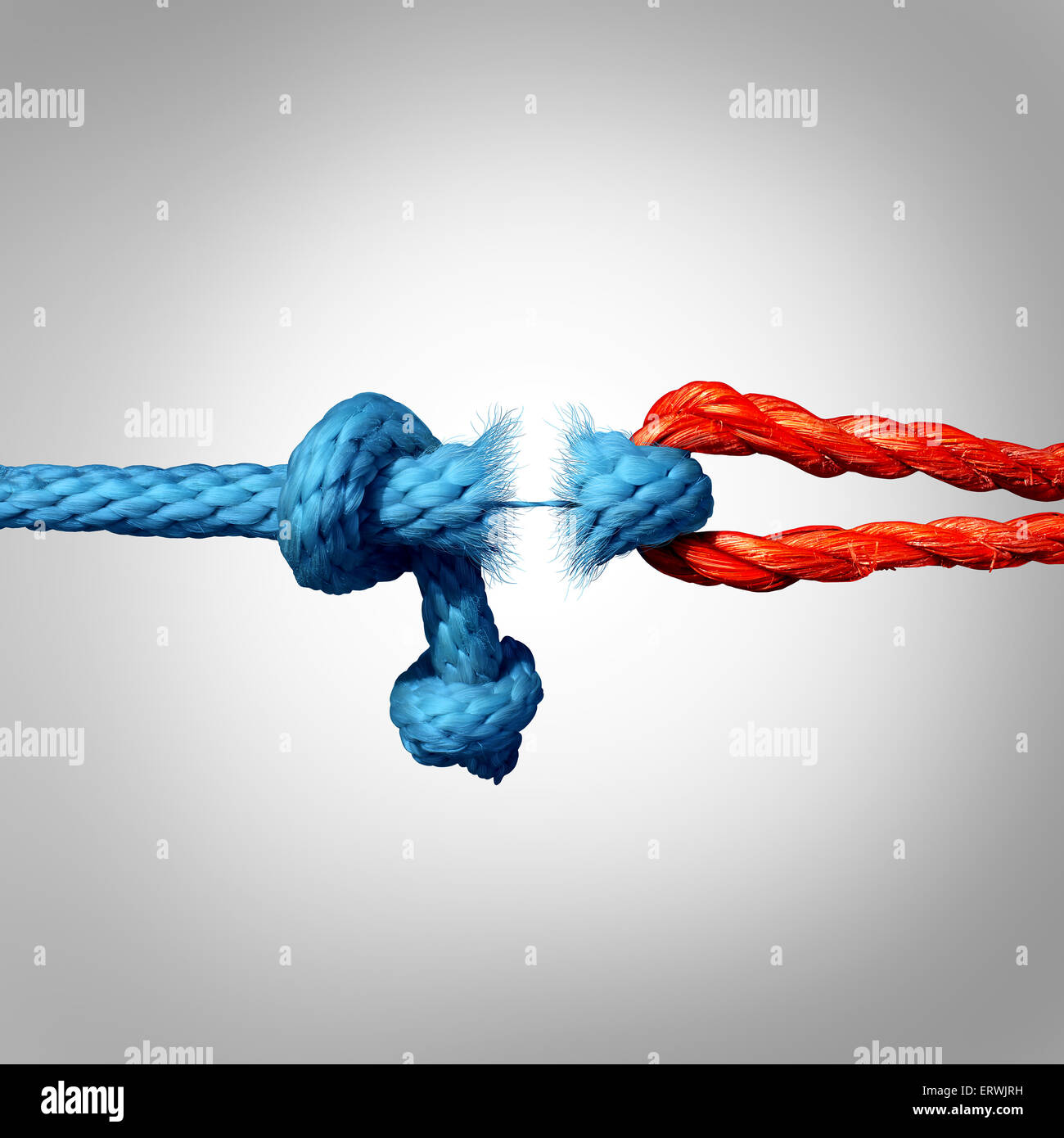 Detached concept and disconnected symbol as two different ropes tied and linked together as a breaking chain and losing trust or faith metaphor as separation and divorce or broken severed relationship. Stock Photo