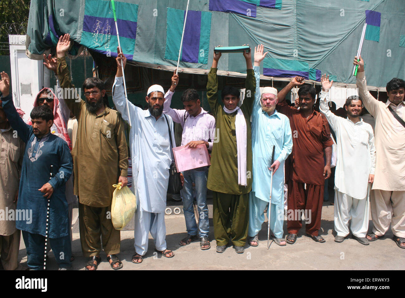 Lahore, Pakistan. 08th June, 2015. Blind men demonstrate asking for