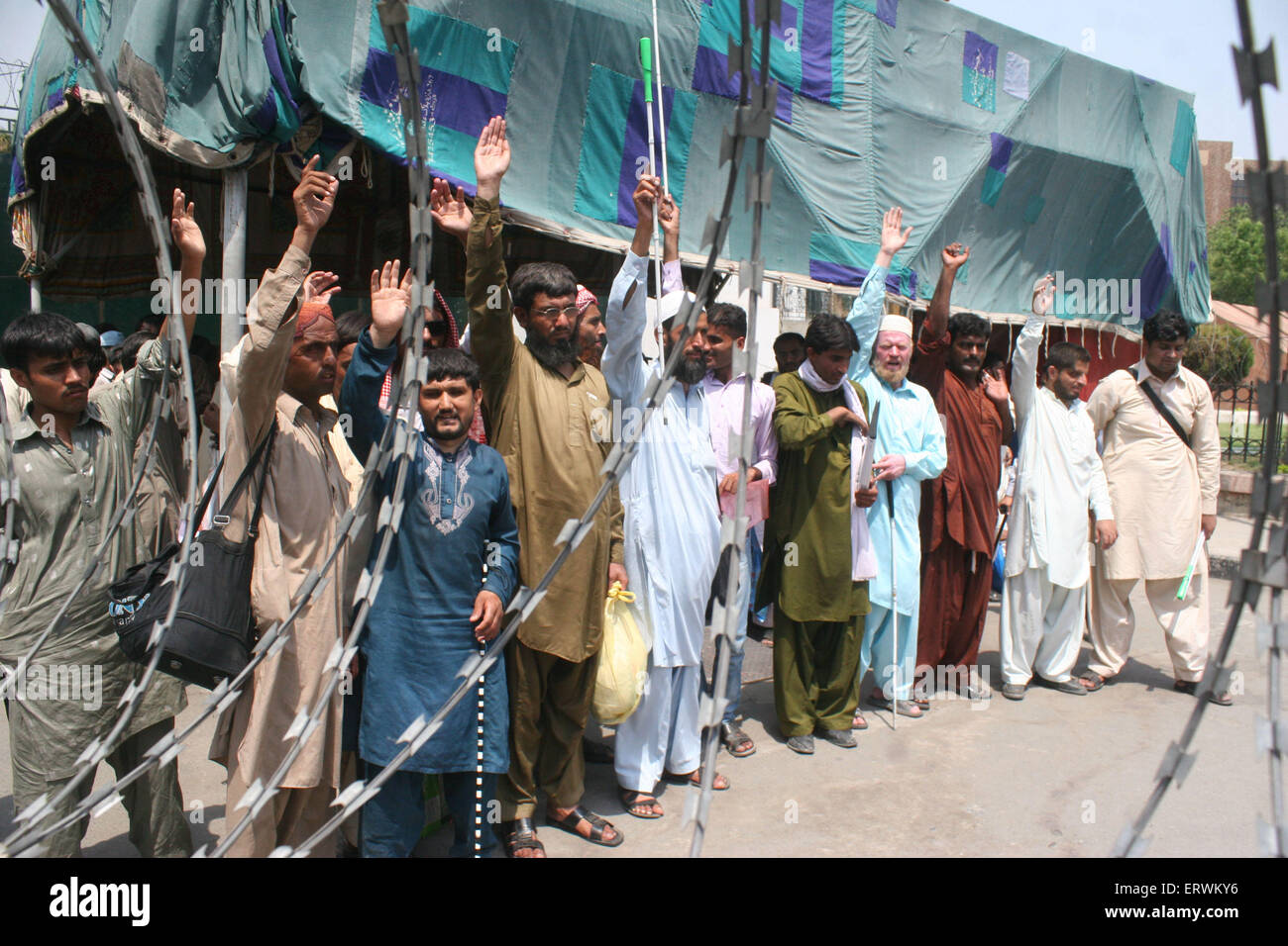 Lahore, Pakistan. 08th June, 2015. Blind men demonstrate asking for