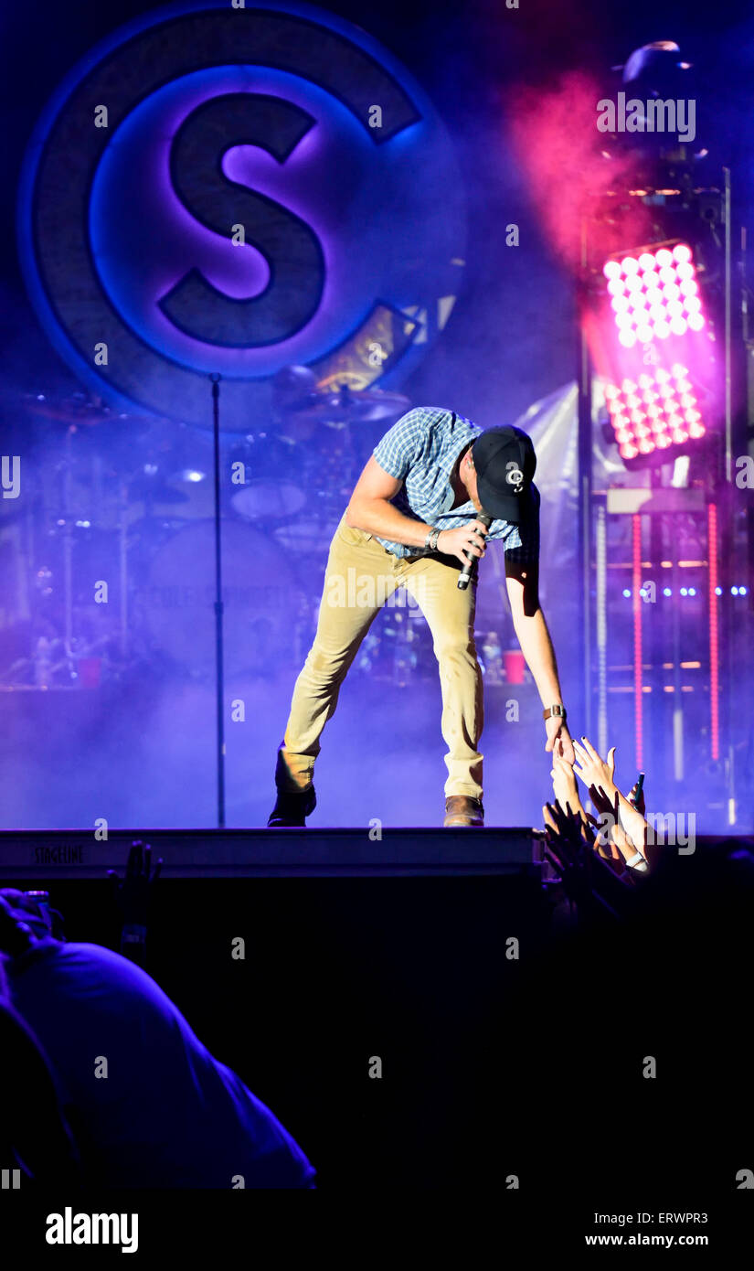Cole Swindell performing at the Carolina Country Music Festival at