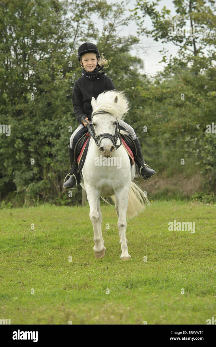 girl rides pony Stock Photo