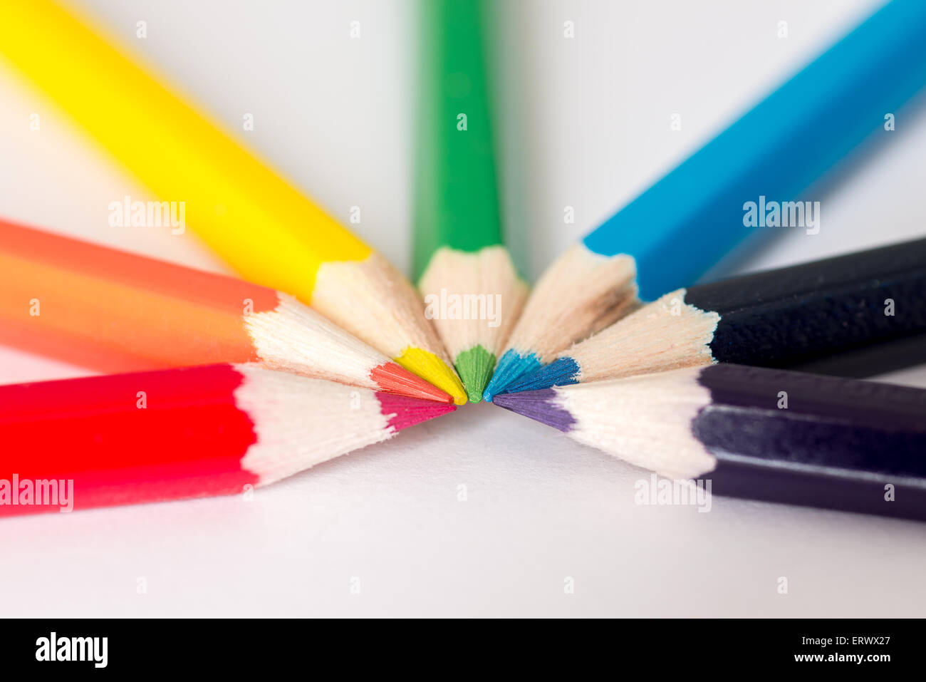 Red, Orange, Yellow, Green and blue pencils in a semi-circle Stock Photo