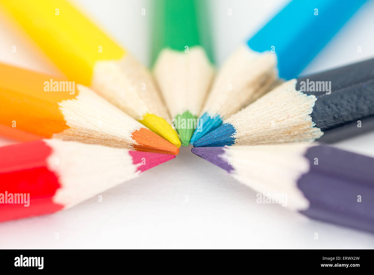 Red, Orange, Yellow, Green and blue pencils in a semi-circle Stock Photo