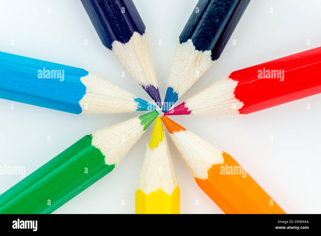 Red, Orange, Yellow, Green and blue pencils in a circle Stock Photo