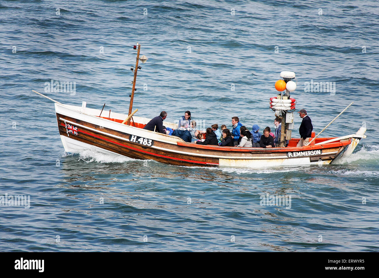 Trip boat with public at sea. Stock Photo