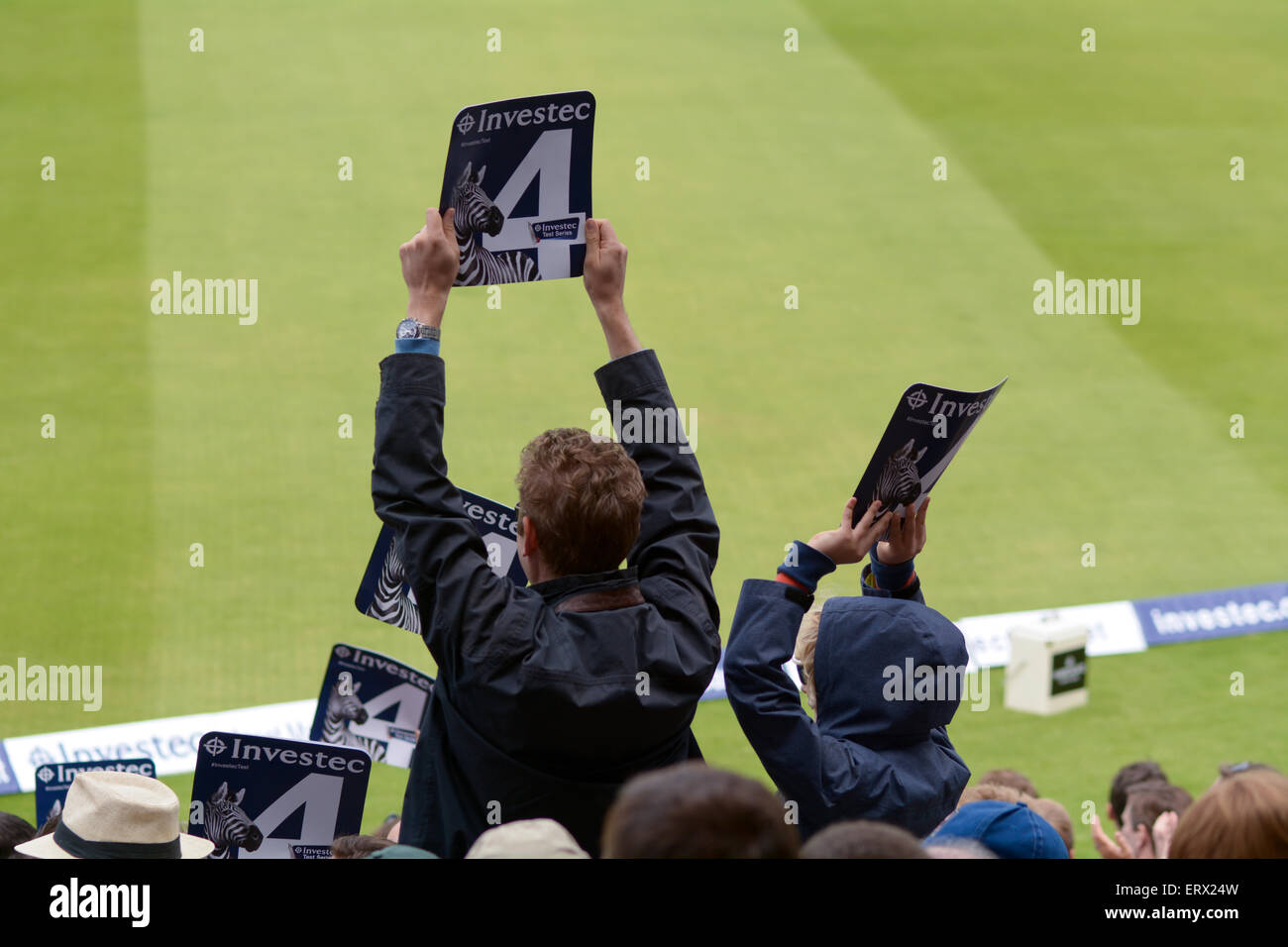 Fans waving six score cards at Lords Cricket Ground 5th day, 2nd Test Match, England vs New Zealand Stock Photo
