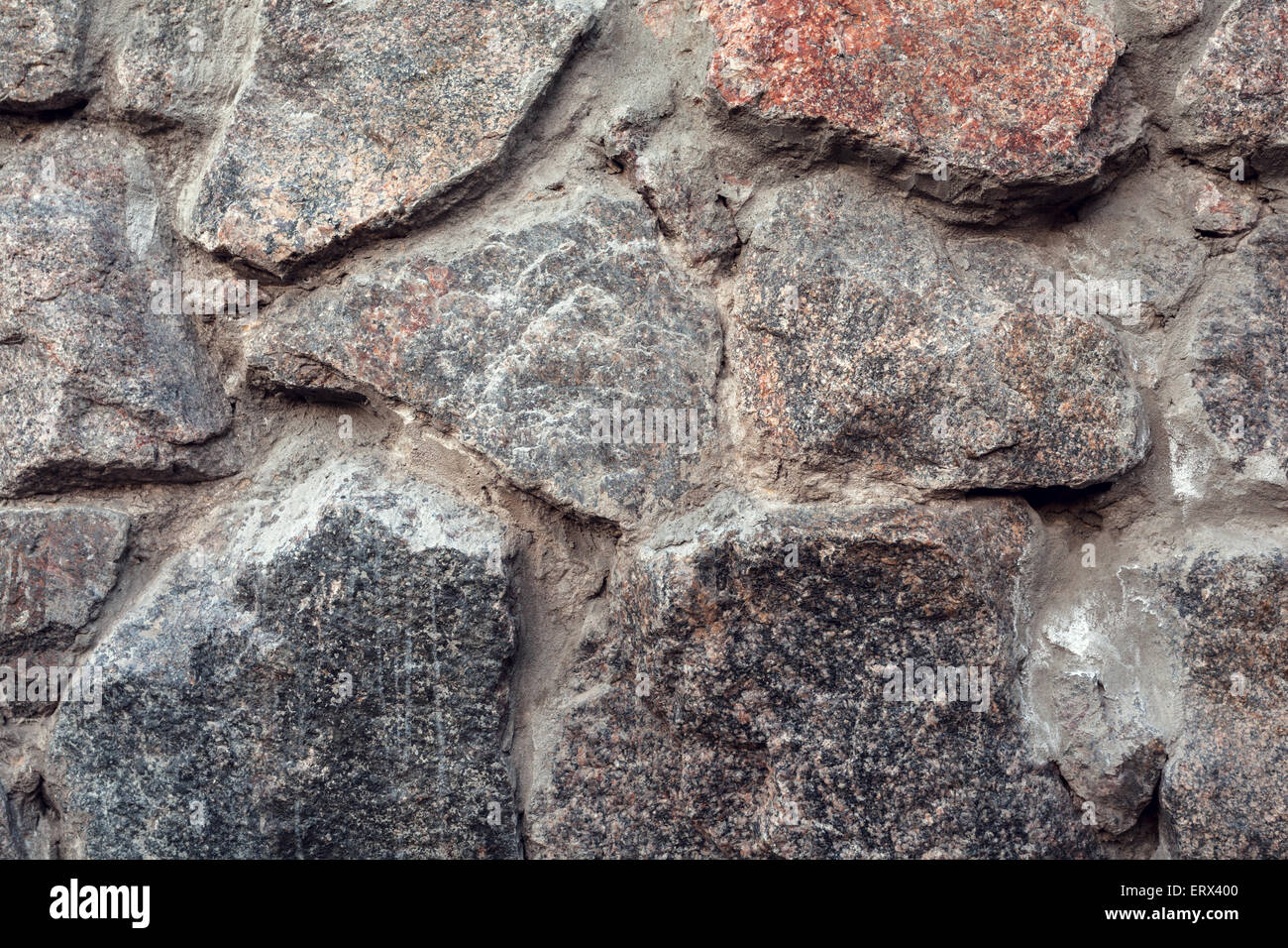 Wall. Natural granite stone texture background. Rough and rusty. Close
