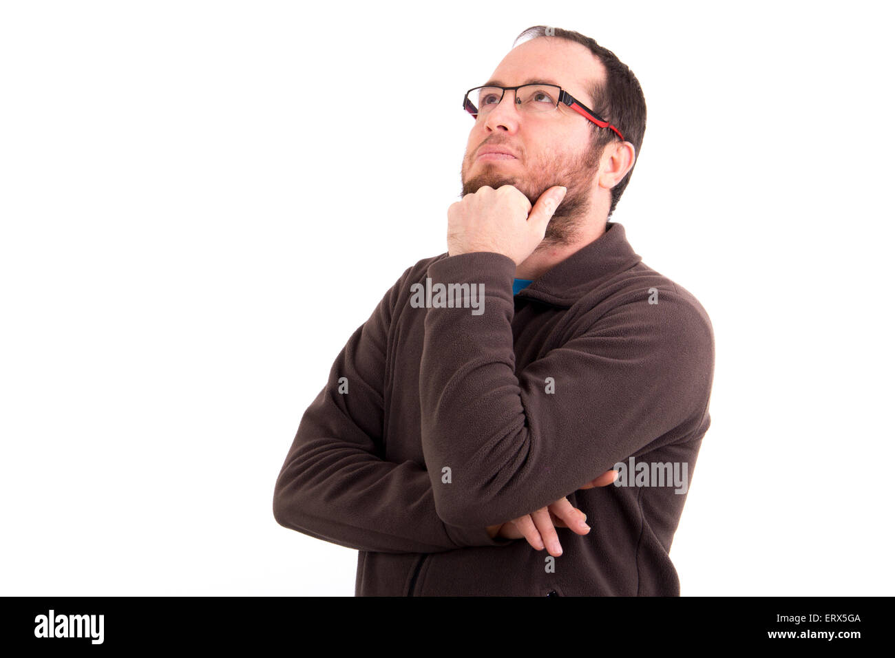 portrait of thoughtful young man looking up isolated on white background Stock Photo