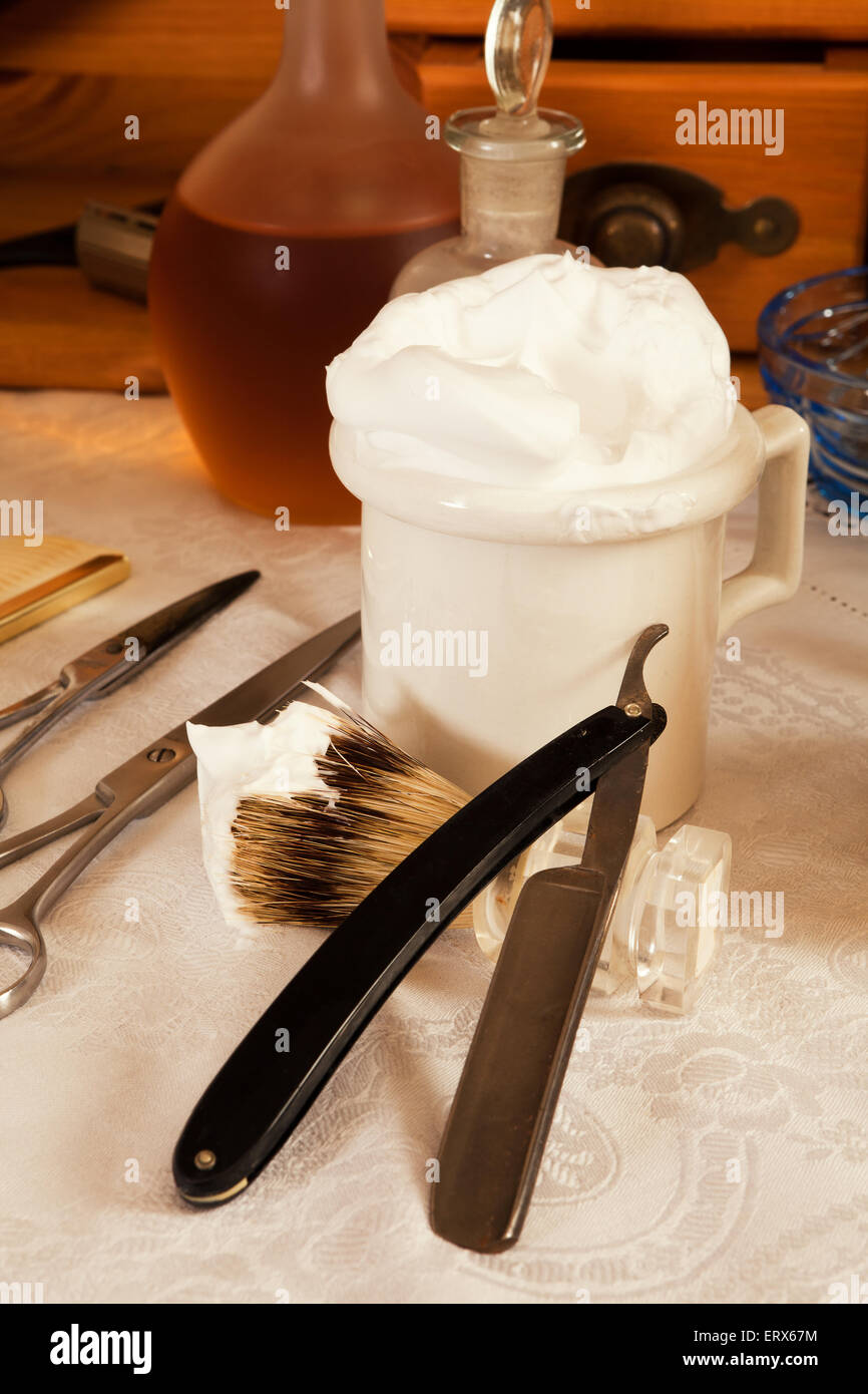 Razor blade and shaving cream in a victorian barbershop Stock Photo