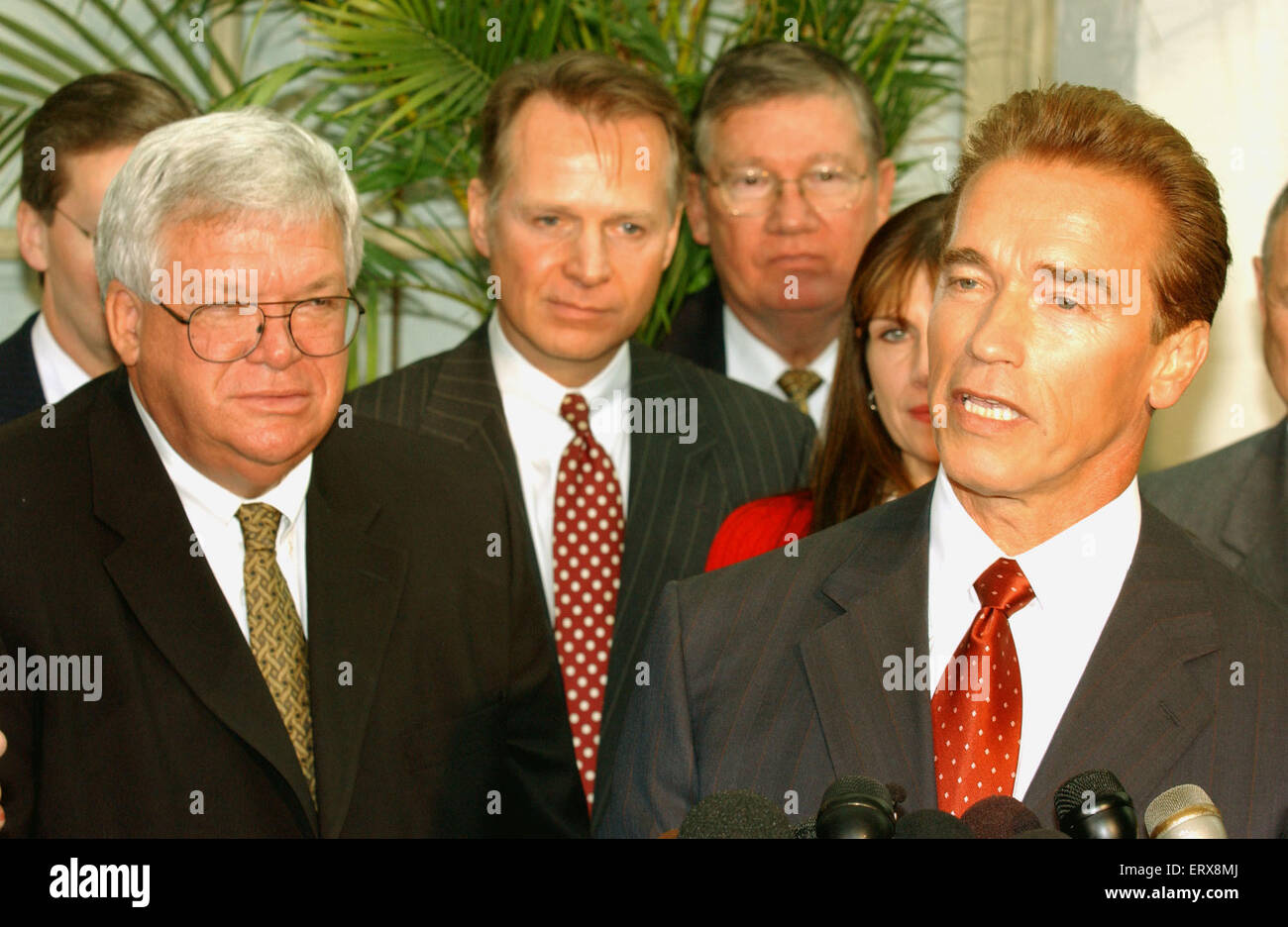 Washington, DC - October 29, 2009 -- California Governor-elect Arnold Schwarzenegger, right, meets reporters in the United States Capitol in Washington, DC on October 29, 2003. He was meeting with the U.S. House Republican Conference to discuss ways to bring more money to California to help eliminate its financial crisis. United States House Speaker Dennis Hastert is at left with other members of the Republican Conference.Credit: Ron Sachs/CNP - NO WIRE SERVICE - Stock Photo