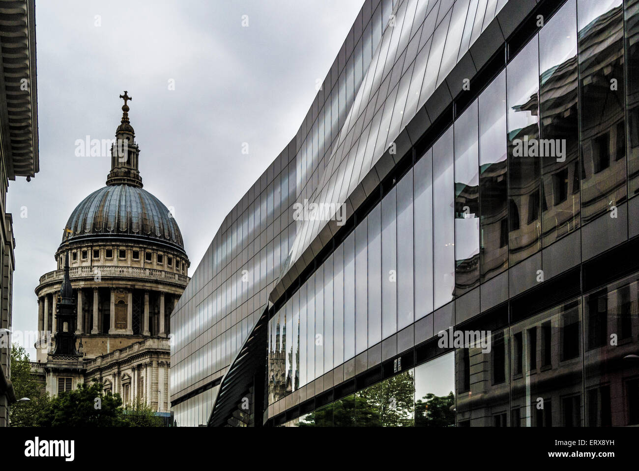 Modern glass office building in Watling Street with St Paul's Cathedral in the distance. London, UK. Stock Photo