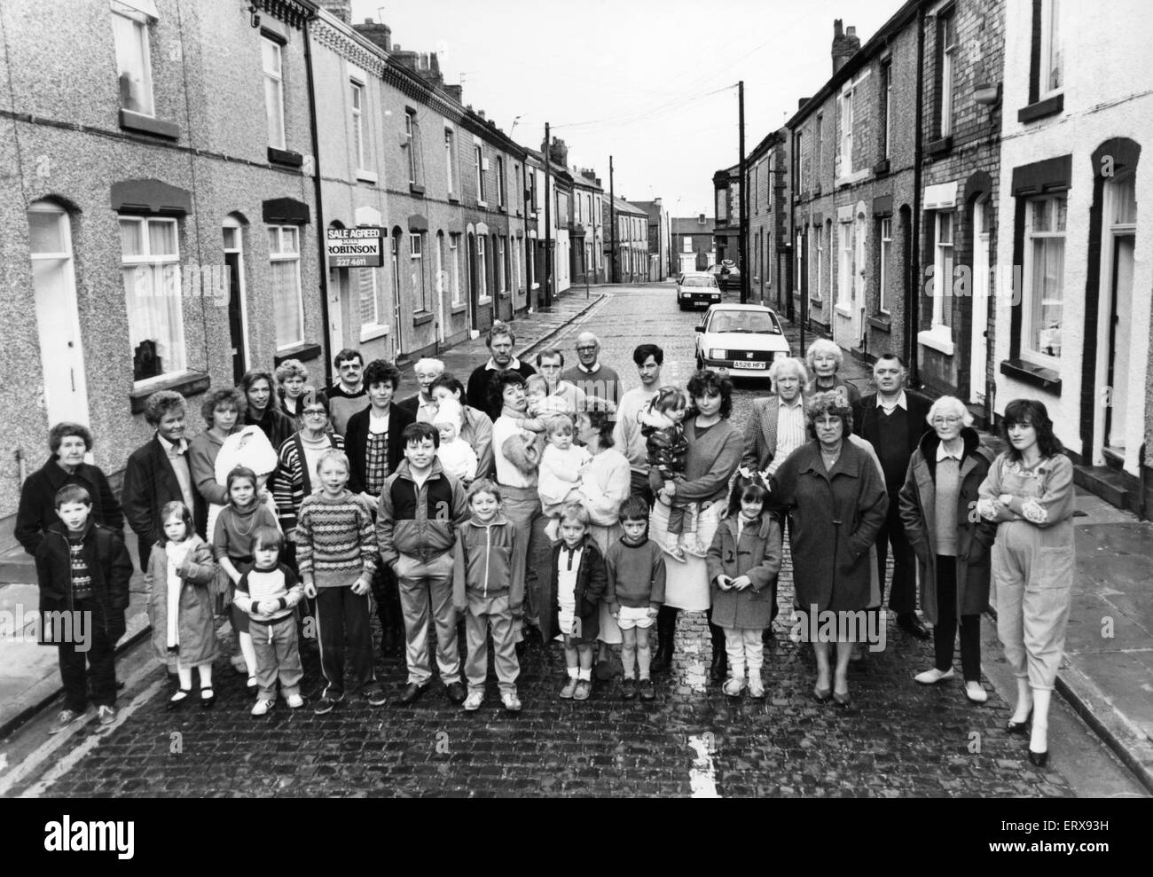 Angry residents of Randolph Street, Anfield protest about the potholes and cobbled street, which is used as a short cut to beat the traffic lights on Sleepers Hill.  Every resident has signed the petition for the the road to be re-surfaced and then to mak Stock Photo
